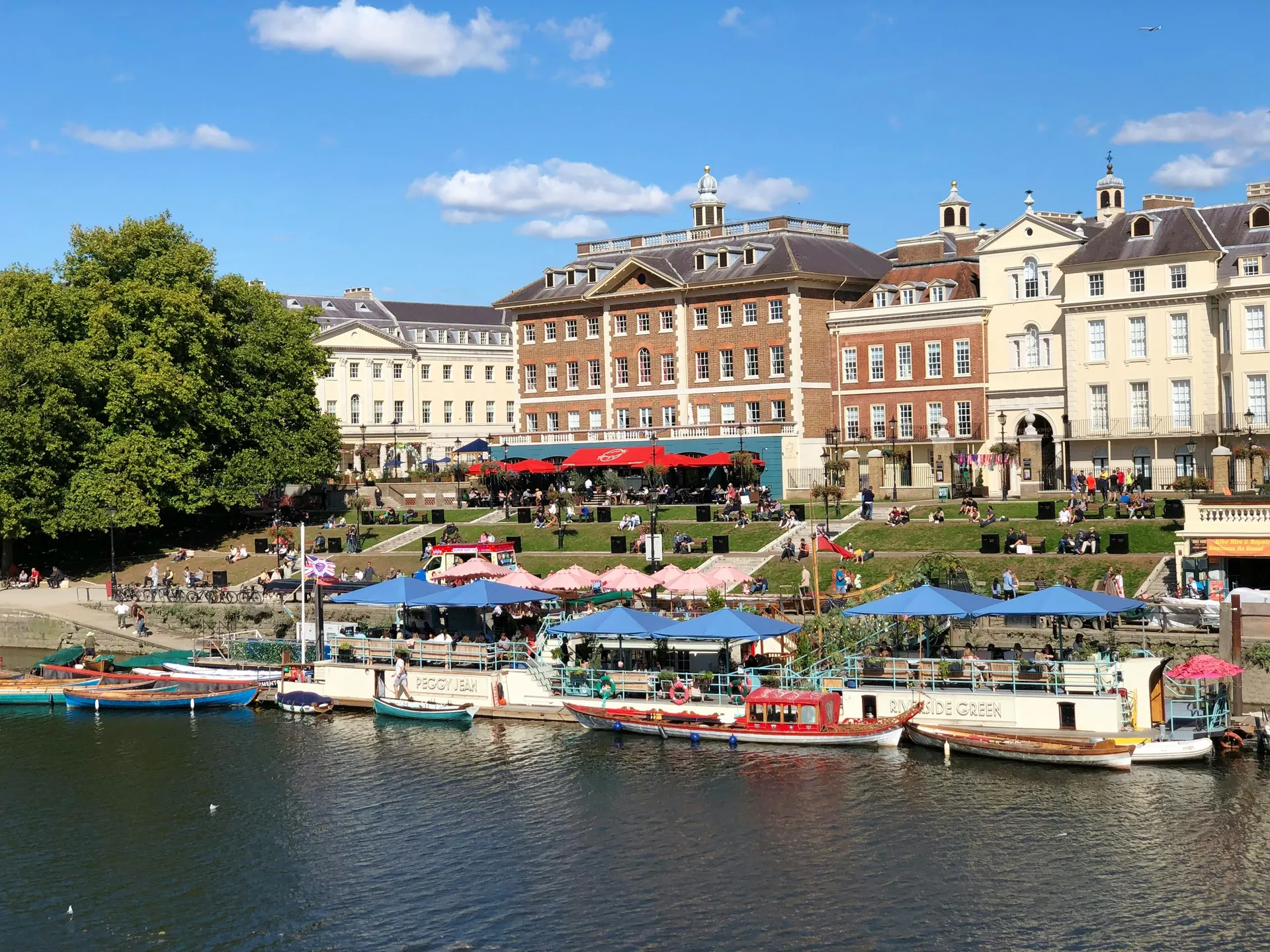 Sunny English waterside terrace for domestic island travel
