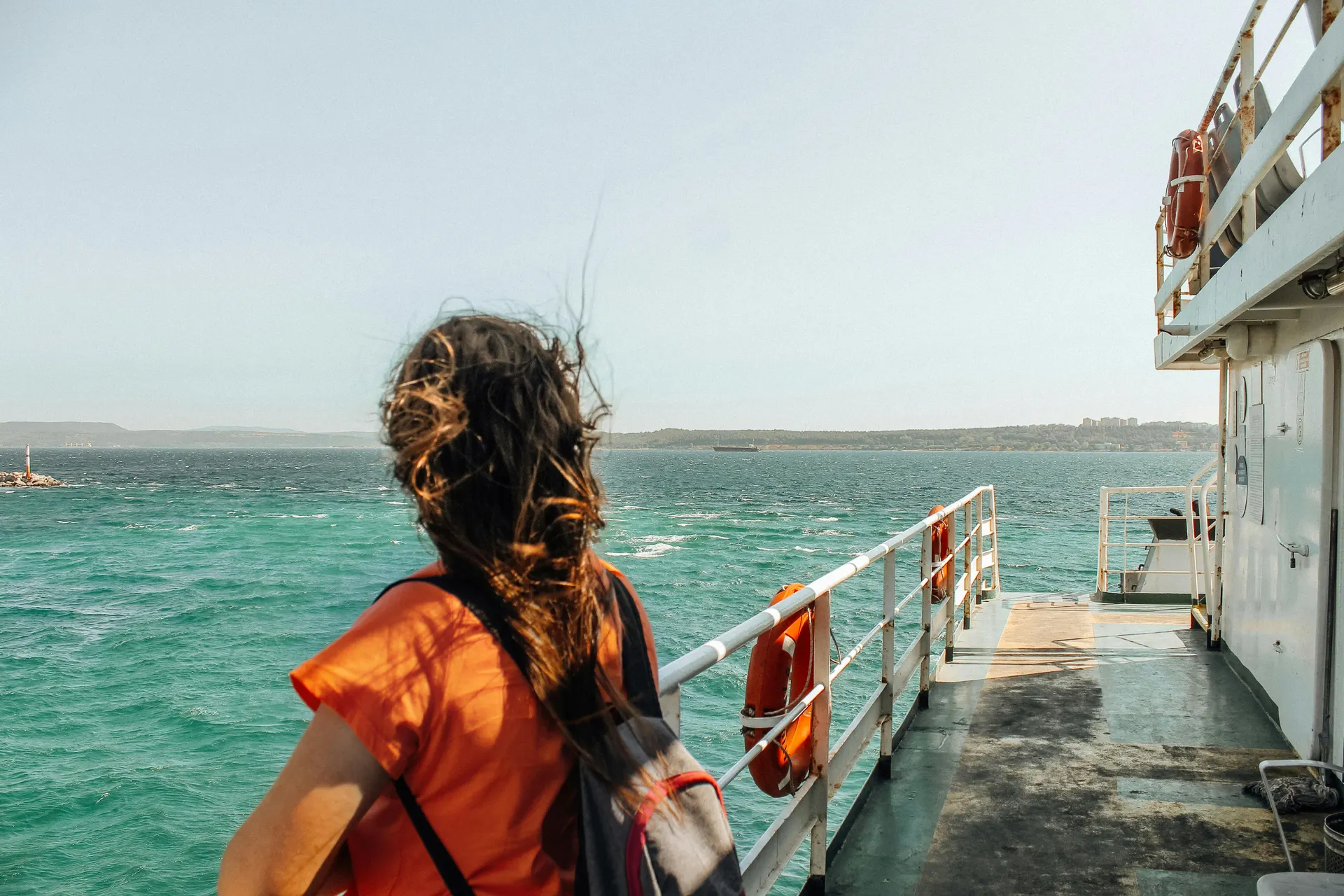 Ferry arriving at a bright island pier in England